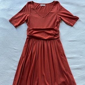 Synergy organic cotton stretch dress, rust orange, hits knee. LNC
